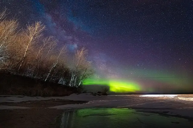 Northern lights over frozen Pinehouse Lake
